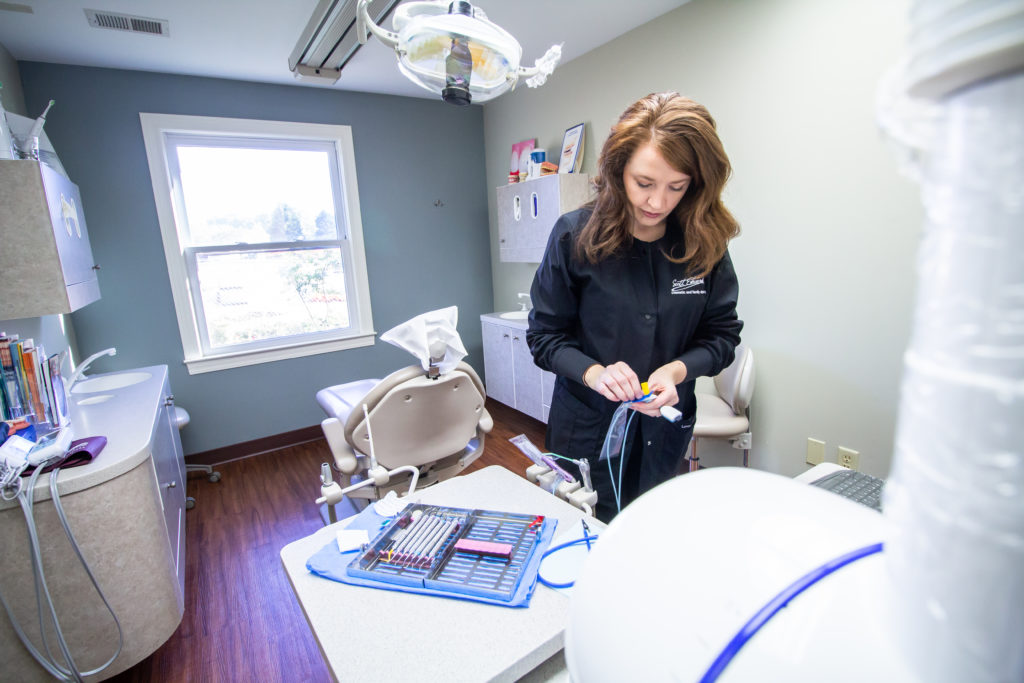 Edwards DDS staff working with a patient