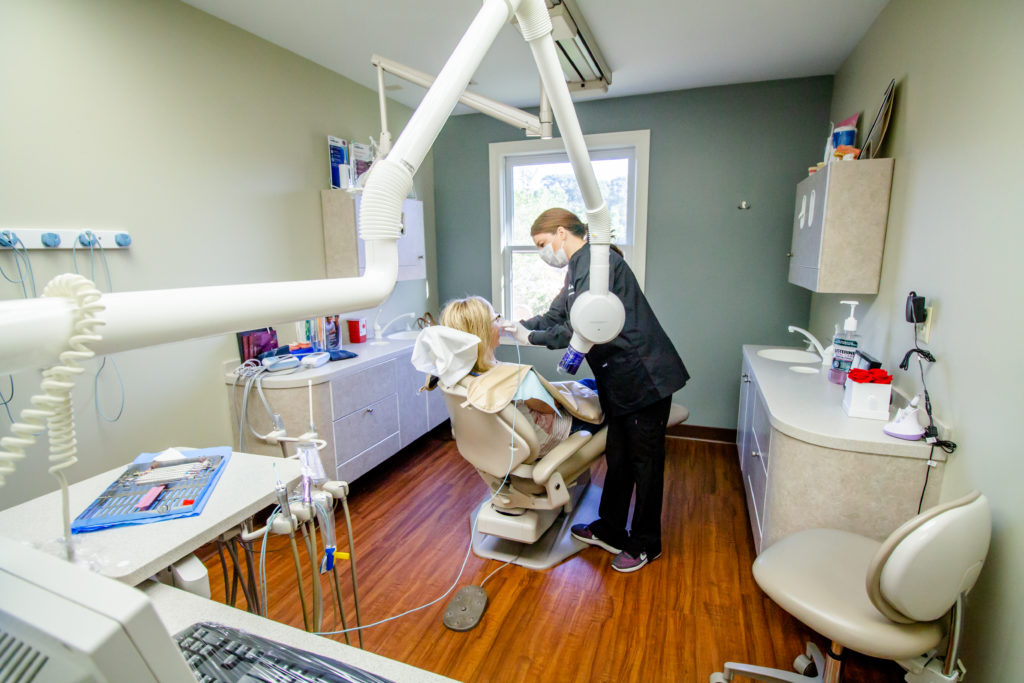 Scott Edwards staff working with a patient