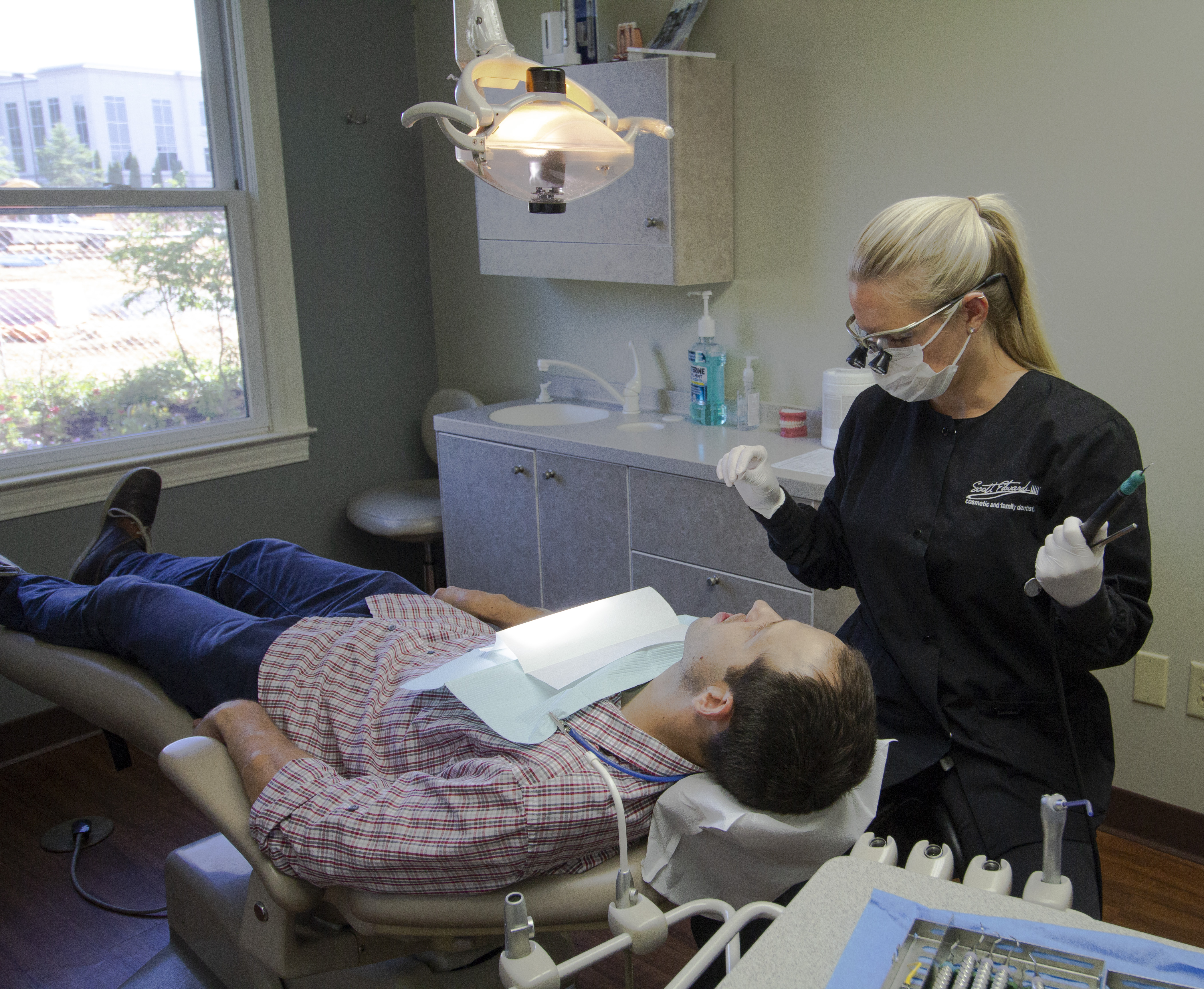 Scott Edwards staff working with a patient