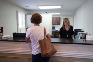 Scott Edwards staff talking to a patient